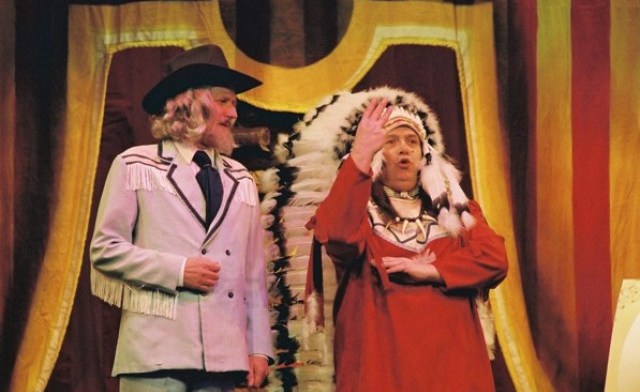 Sitting Bull offers Wild Bill Hickock heap big wampum for his snazzy jacket.